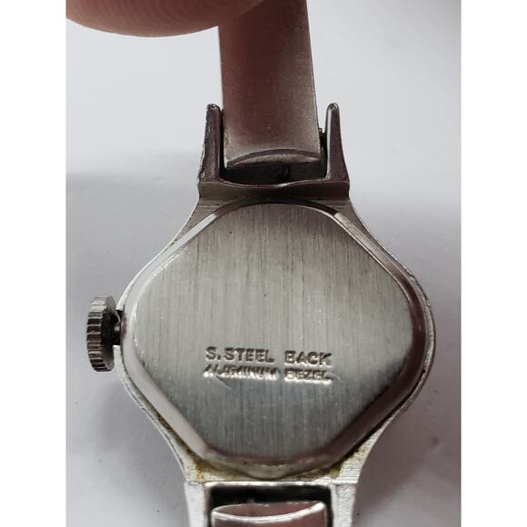 Small women\'s Timex dress watch. Oval Silver opalescent face. Bangle style band main image 7